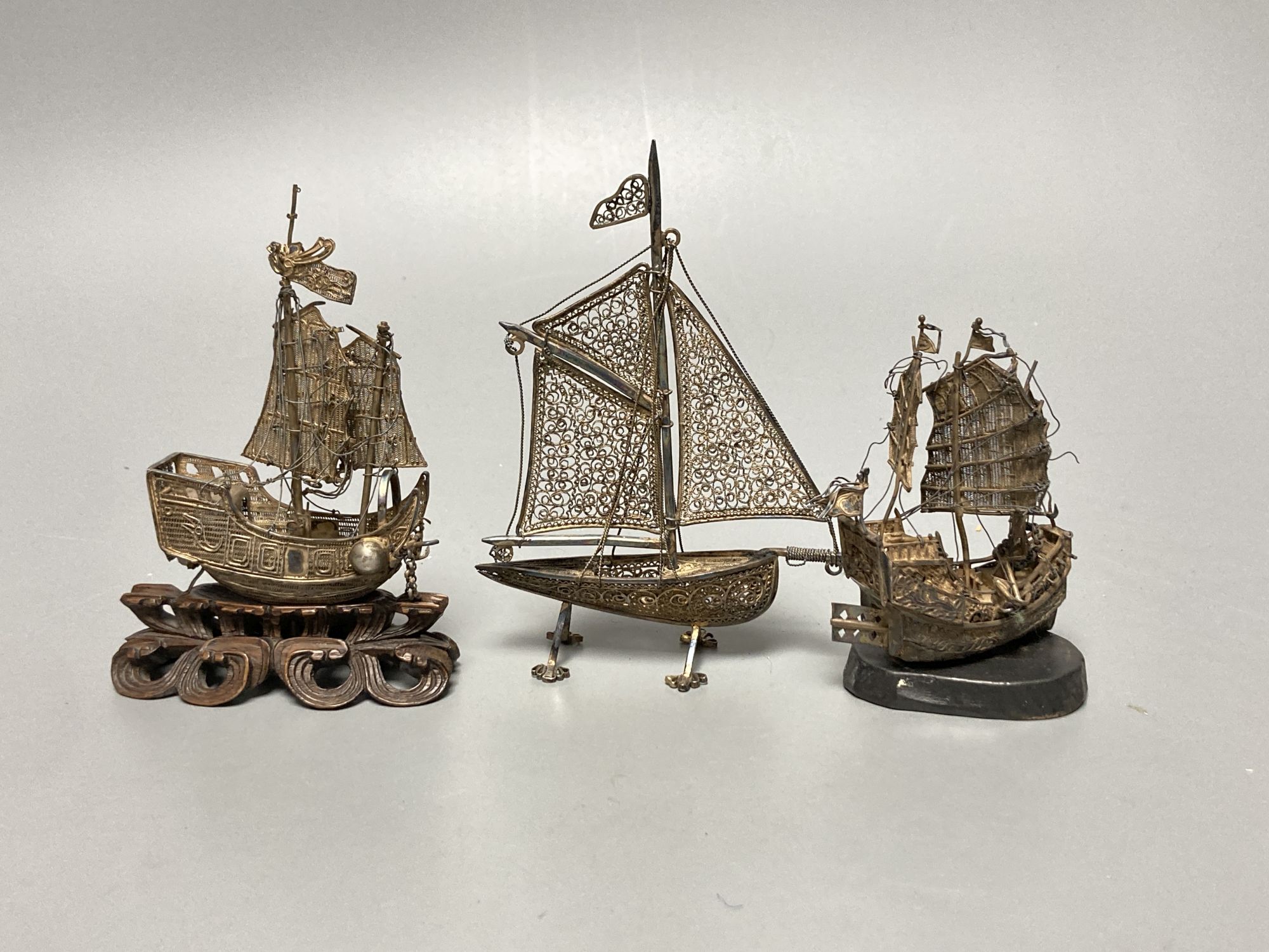 Three filigree boats, an enamelled flower pot and a snuff bottle